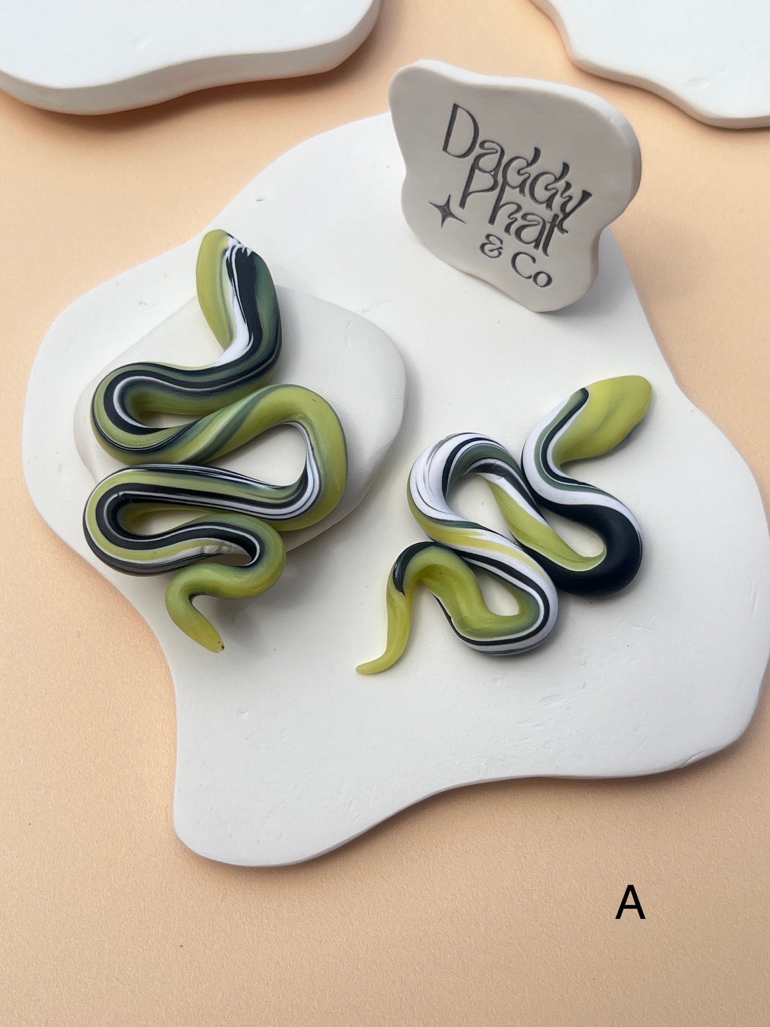 polymer clay snake serpent earrings green black and white swirl pattern