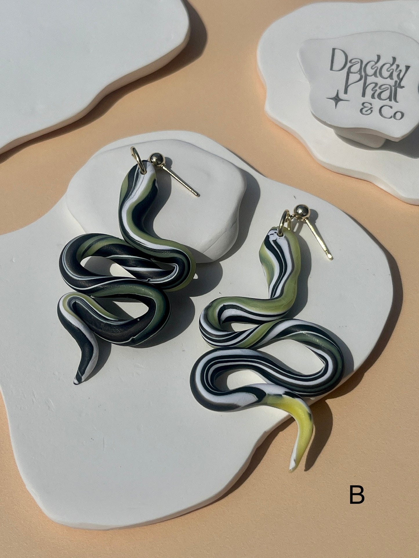 polymer clay snake serpent earrings green black and white swirl pattern