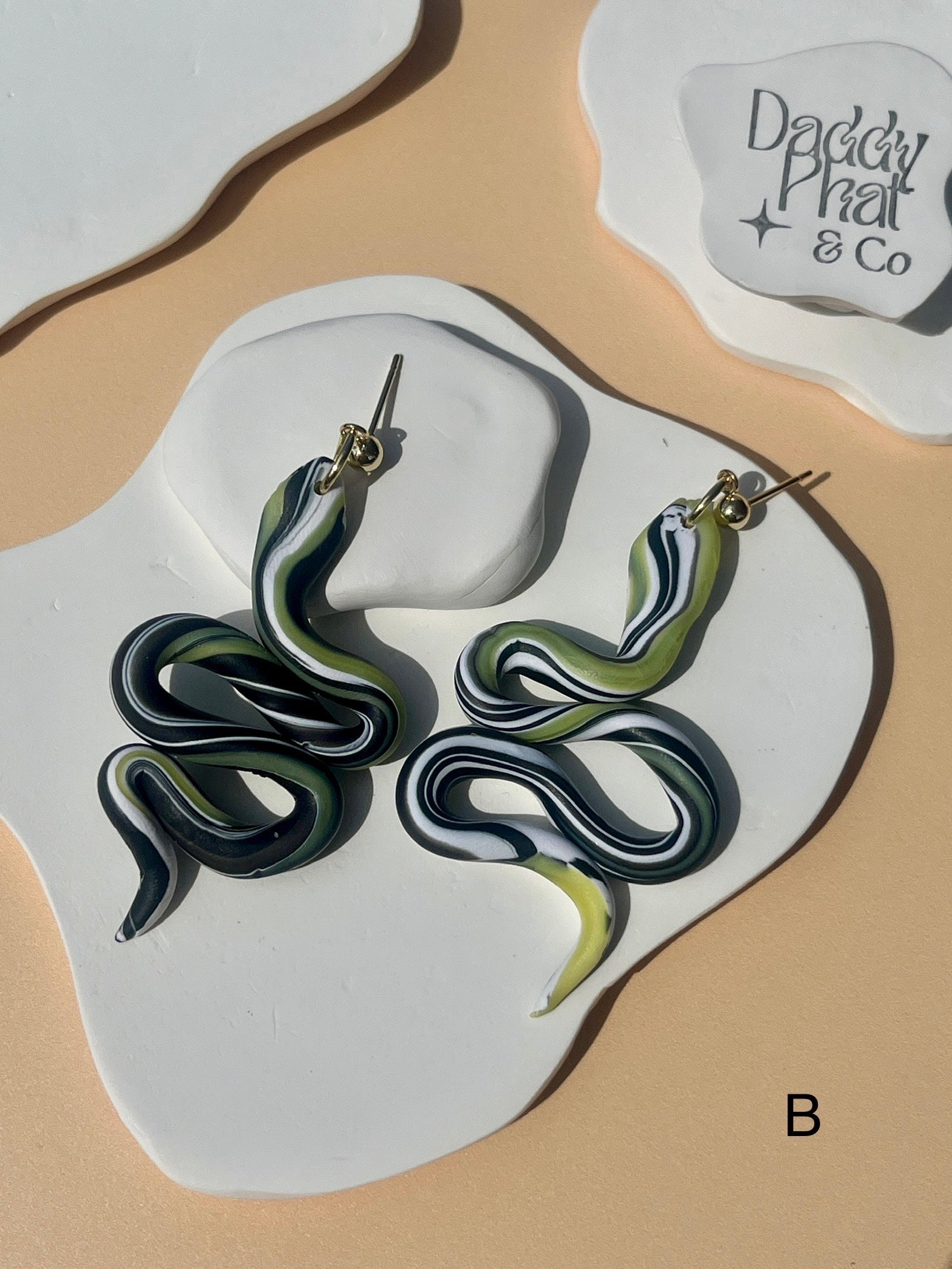 polymer clay snake serpent earrings green black and white swirl pattern