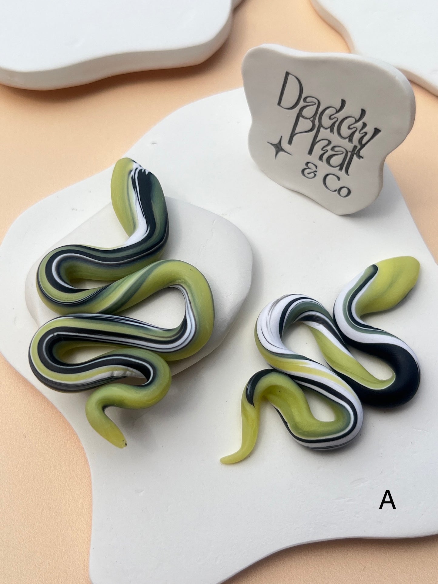 polymer clay snake serpent earrings green black and white swirl pattern